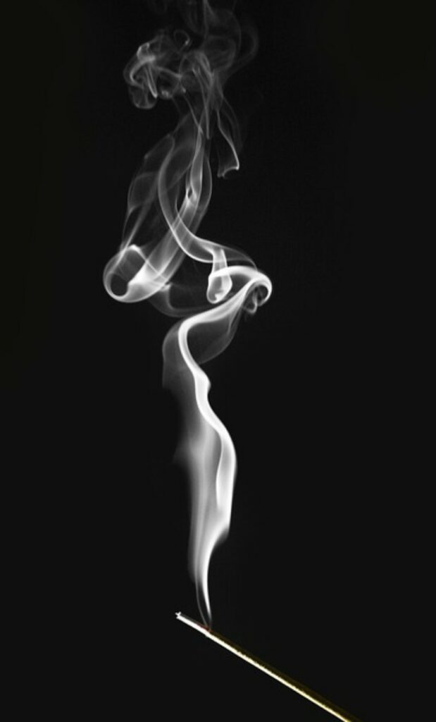incense curling smoke
