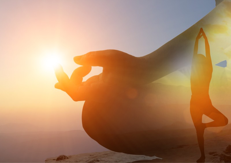 silhouette of woman doing meditation